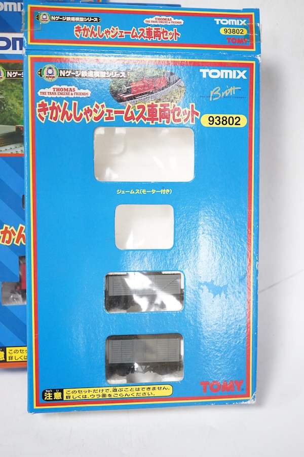 Four boxed Tomix (by Tomy) N gauge railway Thomas the Tank Engine & Friends train packs, comprising of three locomotives and rolling stock (one locomotive and a wagon missing): James (93802) - James and one wagon missing